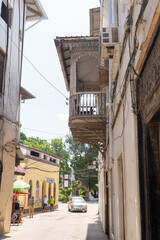 Fototapeta na wymiar Streets in heart of Stone Town Zanzibar which mostly consists of a maze of narrow alleys lined by houses