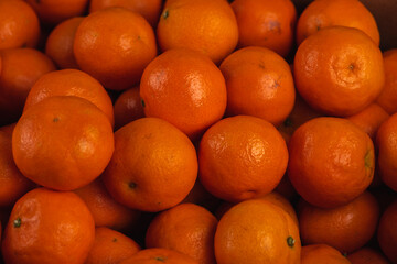 Fresh mandarin oranges fruit or tangerines, as background, background. Selective focus