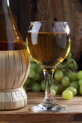 glass of white wine and bottle