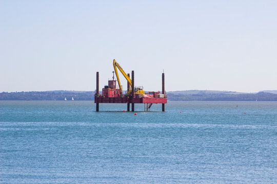17 September 2019 An industrial work platform involved in coastal maintenance and repairs on the Solent at the coast in Fareham Hampshire England