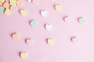 Pink Valentine's Day background with heart candy.