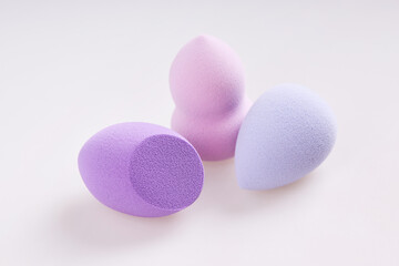 Set of colorful makeup blending sponges (beauty blenders) isolated on a white background.