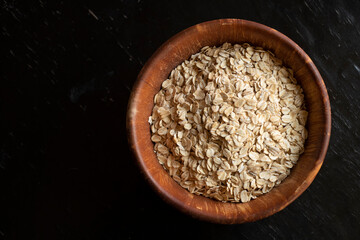 wooden bowl of oats 