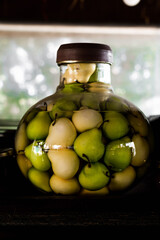 pickled cucumbers in glass jar