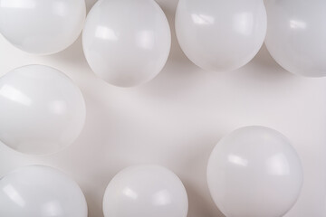 White balloons on white background with copy space.Wedding and  greeting card.