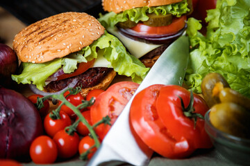 Delicious burger. Still life of vegetables and hamburger.