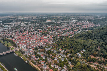 Aerial drone shot of Neckar river through Heidelberg new town in overcast summer morning