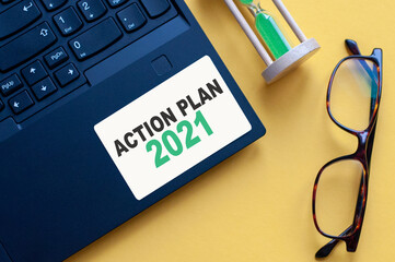 white paper with text Action Plan 2021 in male hands on a white background