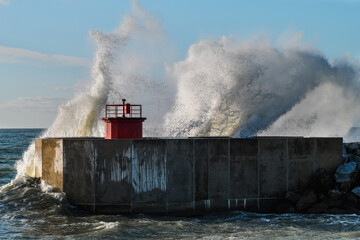 Fototapeta na wymiar Lighthouse in a storm on the coast
