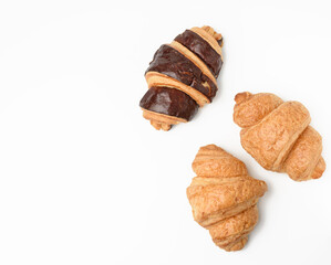 baked chocolate croissant made from white wheat flour on white background