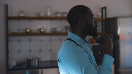 Close up of diverse policemen with flashlight and radio set examining empty apartment
