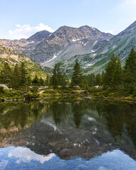 The nature and landscape of the alps seen from the shores of Lake Arpy, in the Aosta Valley, near the town of La Thuile, Italy - August 2020.