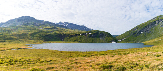 Fototapeta premium The mountains, meadows and lakes of the Aosta Valley near the town of La Thuile, Italy - August 2020.