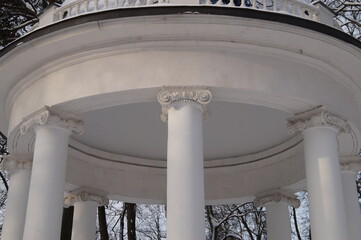 White gazebo in a snow-covered park