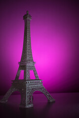 Fototapeta na wymiar Colorful Eiffel tower on a lighted surface 