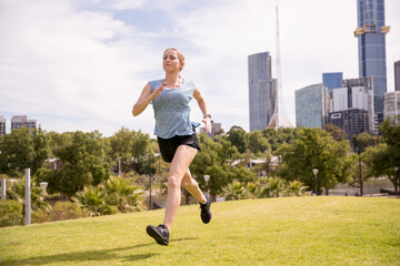 Young Woman Jogging After Work in Downtown Melbourne Australia