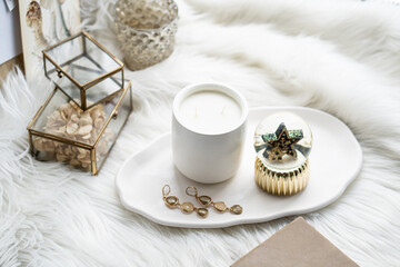 Beautiful home decorations with candle and star on white tray