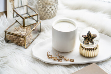 Beautiful home decorations with candle and star on white tray
