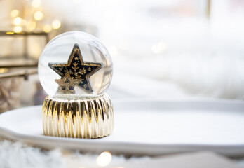 Gold christmas star in glass ball, new year decoration