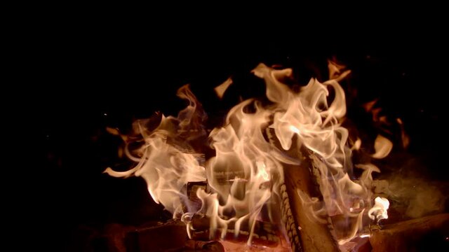 Close-up: super slow motion of fire line isolated on black background. Filmed on high speed cinema camera