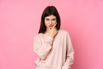 Young Ukrainian teenager girl over isolated pink background thinking