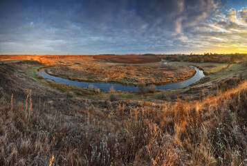 Autumn nature. Landscape of sunrise over river in autumn morning. Nature of Ukraine