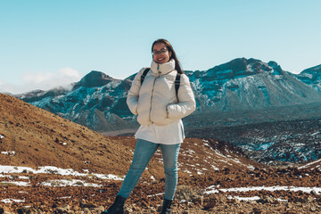 Woman posing in some snowy mountains