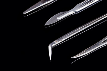 surgical instruments work tool set isolated on a black background. surgery concept