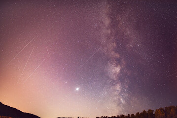 Milky Way, Jupiter and Saturn planets and satellite  in the night sky.