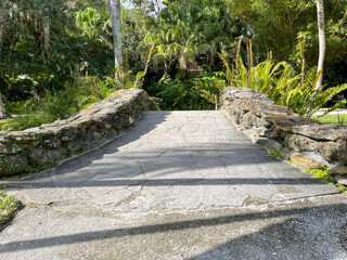 A stone bridge at a tropical botanical garden