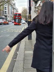 Foto op Plexiglas LONDON, UK, NOVEMBER, 2019: Woman taking red bus © Welinton