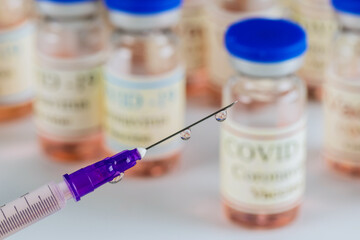 Vaccine to fight the of Covid-19 Coronavirus SARS-CoV-2 in bottle sterile vial and syringe