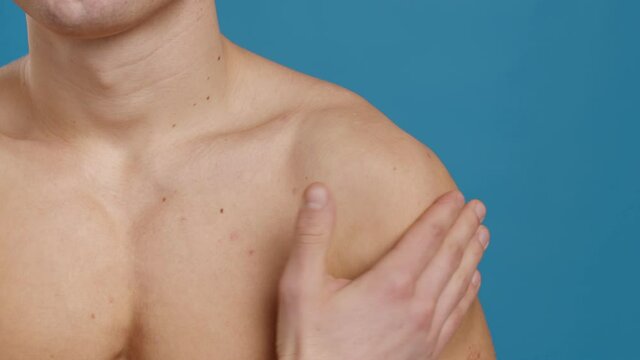 Muscle pain. Close up shot of unrecognizable man massaging his inflamed shoulder