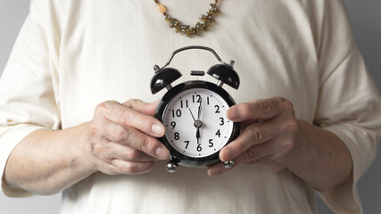 Senior generation with an alarm clock. Elderly time, utilization of time, lifestyle, time left,...