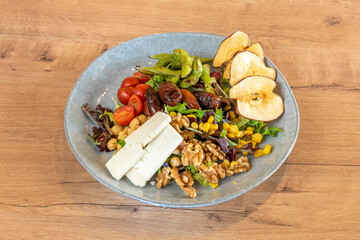 super salad with walnuts, apple, tomatoes and cheese