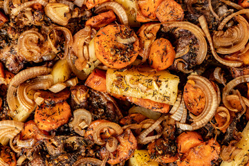 Oven baked meat with vegetables close-up. Top view.