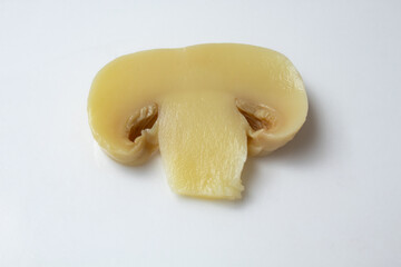 Canned champignon mushroom cut in slice and on white background