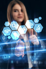 Business, Technology, Internet and network concept. Young businessman working on a virtual screen of the future and sees the inscription: Government