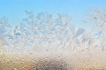 Beautiful winter frost patterns on the window glass. Macro