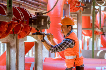 Engineer under checking the industry cooling tower air conditioner is water condenser cooling tower...