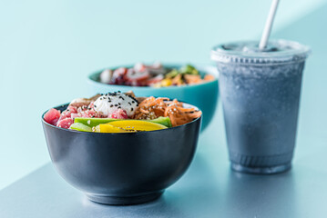 Hawaiian salmon, tuna and shrimp poke bowls with seaweed, avocado, mango, pickled ginger, sesame seeds. 