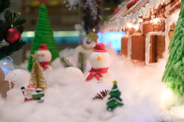 Mini resin snowman doll in the snow fake for Christmas festival