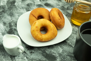 Fresh and crispy donut and coffee with milk