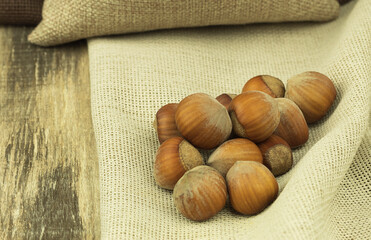 Hazelnuts in a bag close-up with space for text