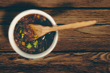 Exquisite and typical spicy chili sauce and green onion to accompany stews in the Andean towns of South America. Aerial view.
