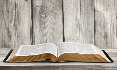 Open vintage Christian bible on the desk