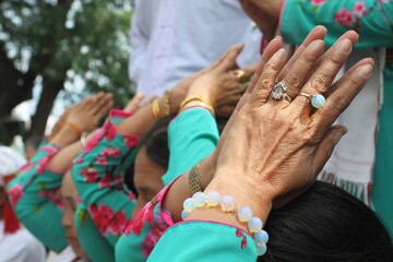Fototapeta premium Close up pictures of group of Champ women praying with hands raise over head in Po Nagar Temple, Nha Trang, Vietnam.