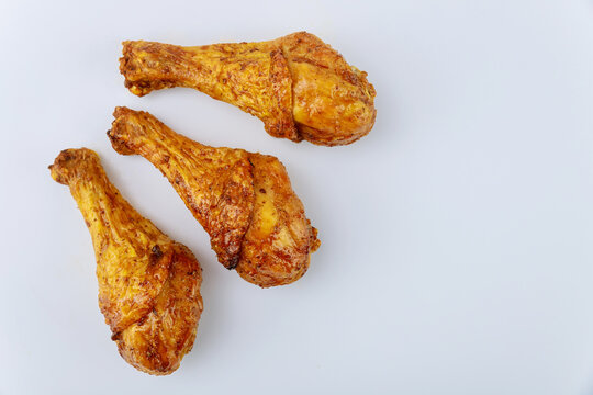 Grilled Chicken Drumsticks Marinated With Buffalo Sauce Isolated On White Background.