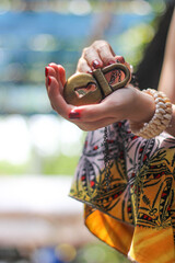 woman with colorful dress holding lock