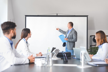 Team of doctors during meeting in modern clinic